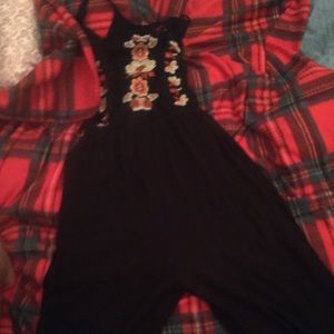 Black jumper with flower embroidery.